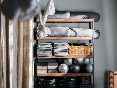 Yoga equipment on the floor in a modern dark interior